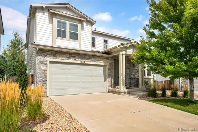 a front view of a house with a garage