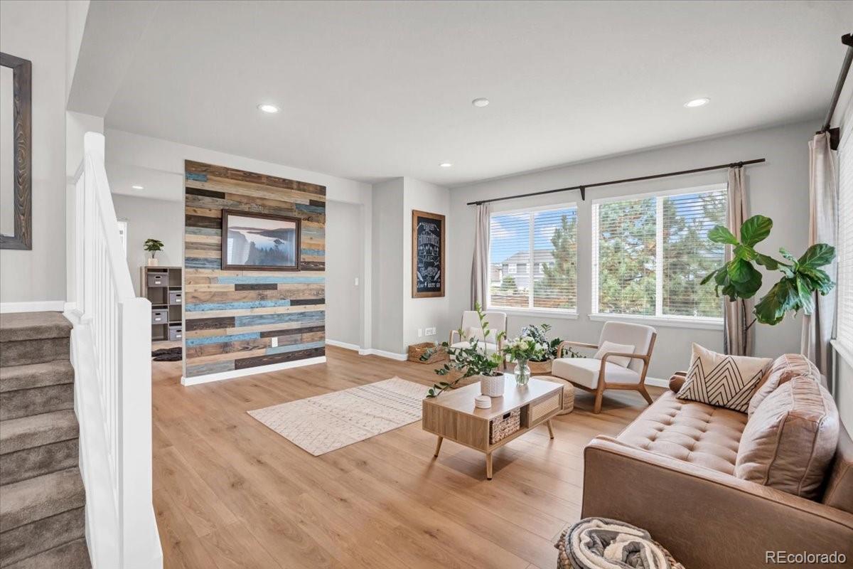 1767 Ghost Dance Circle Castle Rock, CO 80108 - Photo 14 of 48 a living room with furniture and a large window