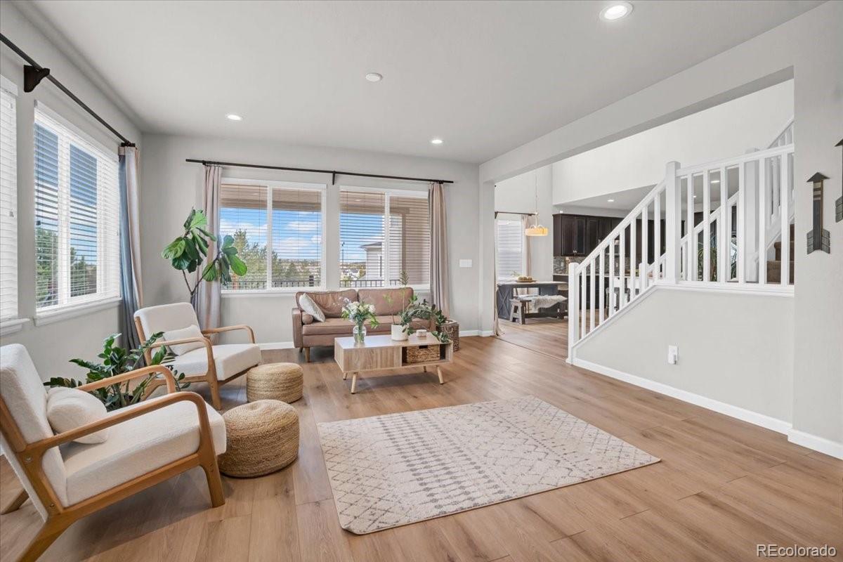 1767 Ghost Dance Circle Castle Rock, CO 80108 - Photo 2 of 48 a living room with furniture and wooden floor