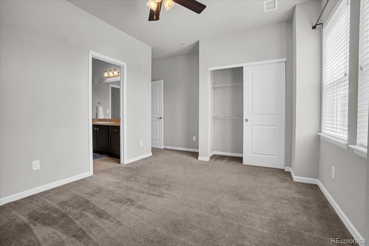 1767 Ghost Dance Circle Castle Rock, CO 80108 - Photo 26 of 48 an empty room with closet and windows