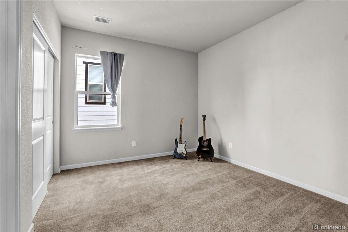 1767 Ghost Dance Circle Castle Rock, CO 80108 - Photo 30 of 48 a view of an empty room with a window