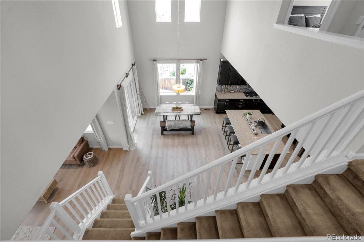 1767 Ghost Dance Circle Castle Rock, CO 80108 - Photo 31 of 48 a view of entryway and hall with wooden floor