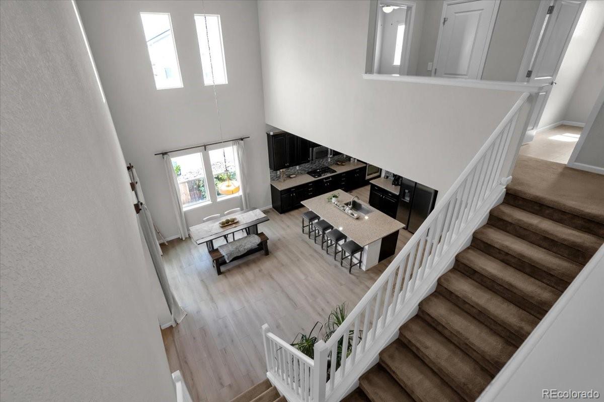 1767 Ghost Dance Circle Castle Rock, CO 80108 - Photo 32 of 48 a view of entryway and hall with wooden floor