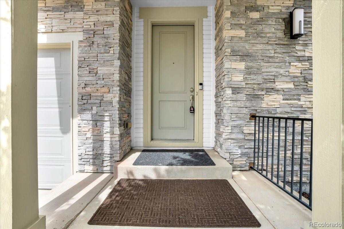 1767 Ghost Dance Circle Castle Rock, CO 80108 - Photo 6 of 48 a view of a entryway door of house