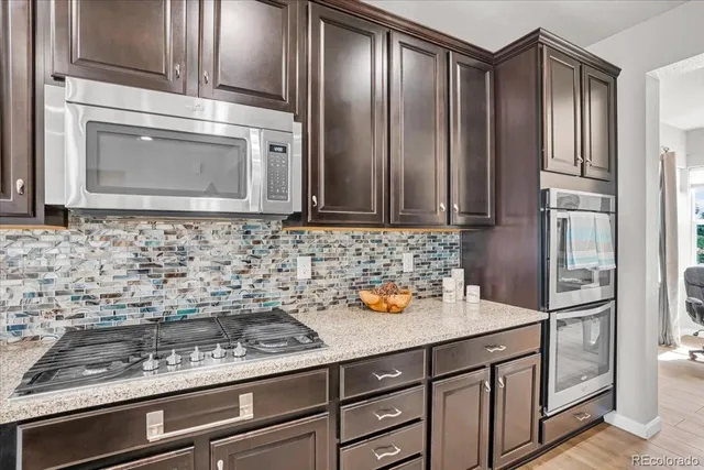 a bathroom with a double vanity sink a mirror and a bathtub