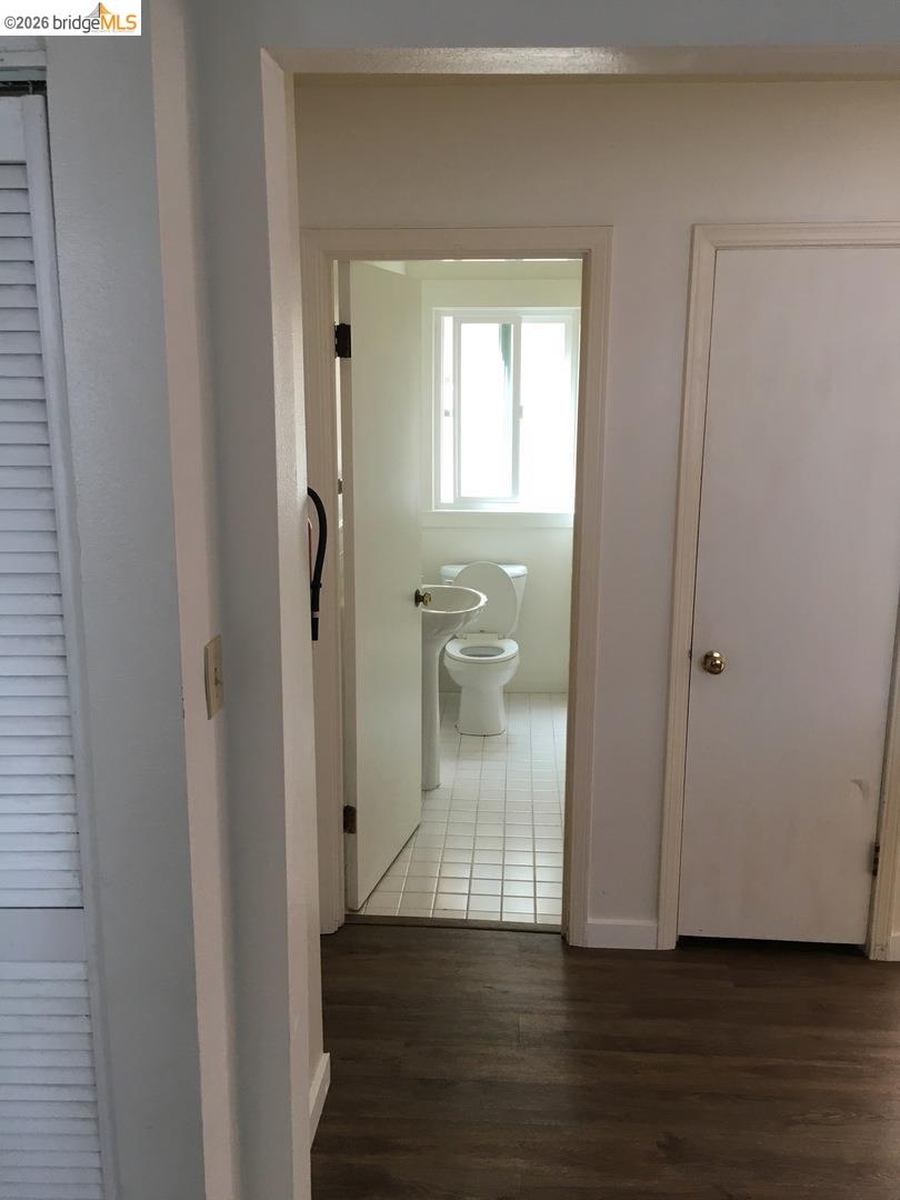 1641 Walnut Street Berkeley, CA 94709 - Photo 9 of 11 hall with dark wood-style floors