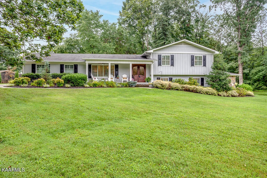 433 Smith Road Knoxville, TN 37934 - Photo 1 of 42 a front view of a house with a garden