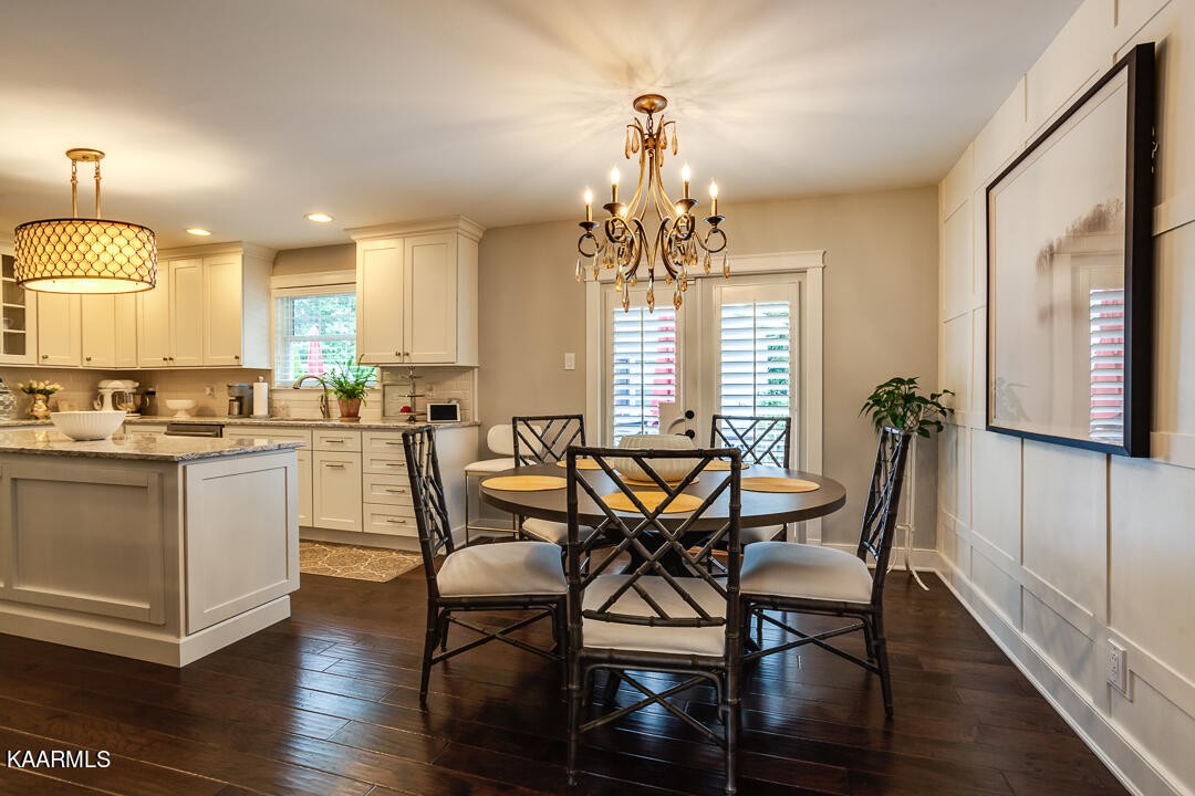 433 Smith Road Knoxville, TN 37934 - Photo 11 of 42 a view of a dining room with furniture window and wooden floor