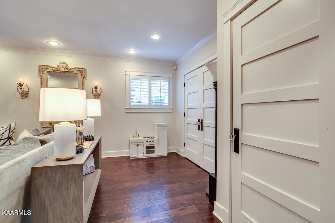 433 Smith Road Knoxville, TN 37934 - Photo 13 of 42 a hallway with wooden floor and furniture
