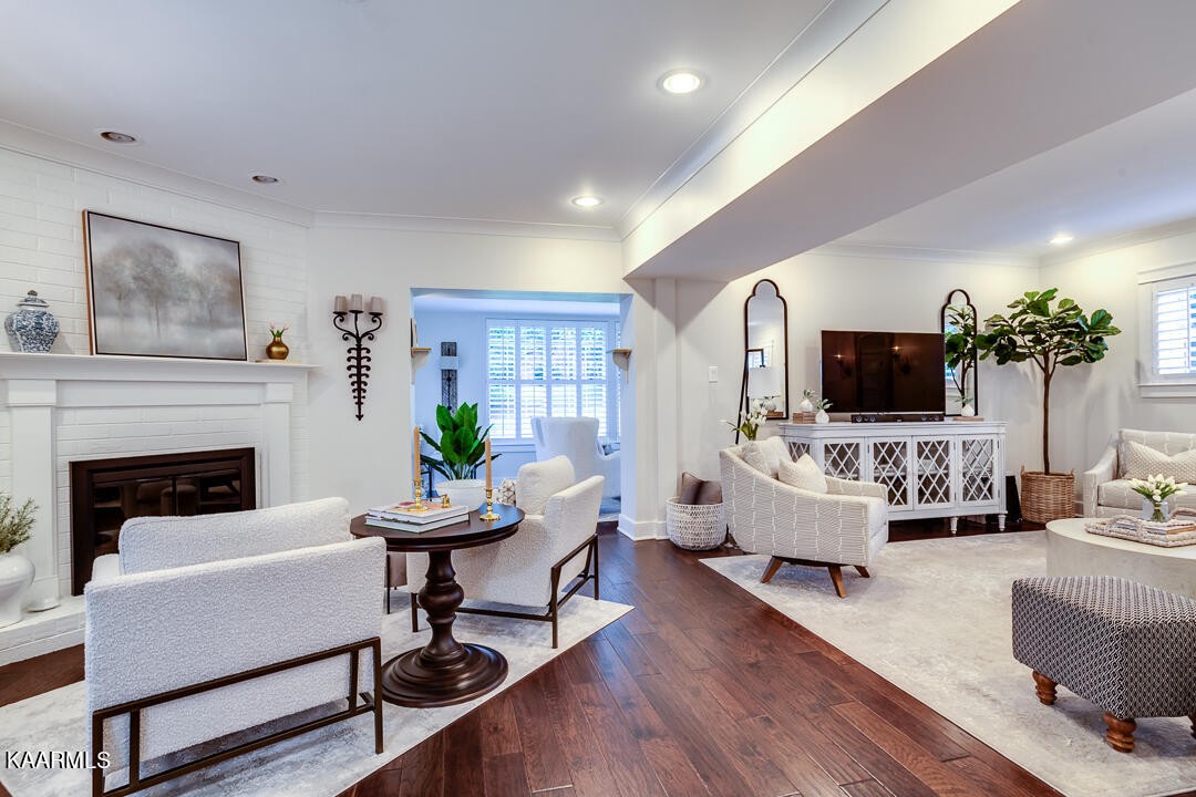 433 Smith Road Knoxville, TN 37934 - Photo 15 of 42 a living room with furniture a fireplace and a flat screen tv