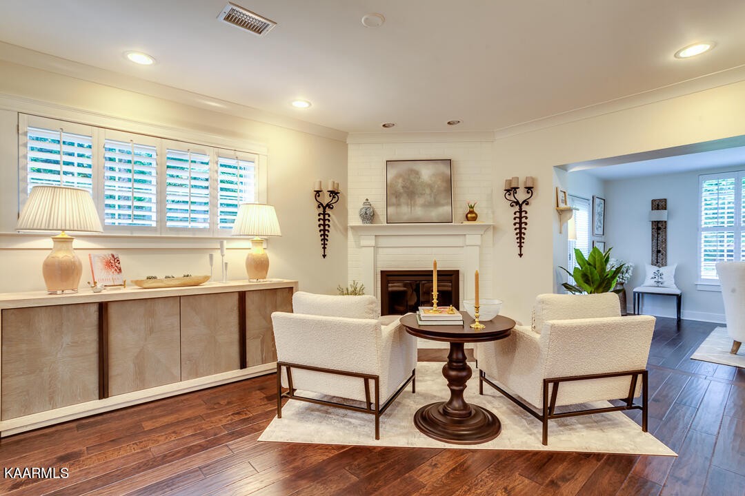 433 Smith Road Knoxville, TN 37934 - Photo 17 of 42 a living room with furniture a fireplace and a table