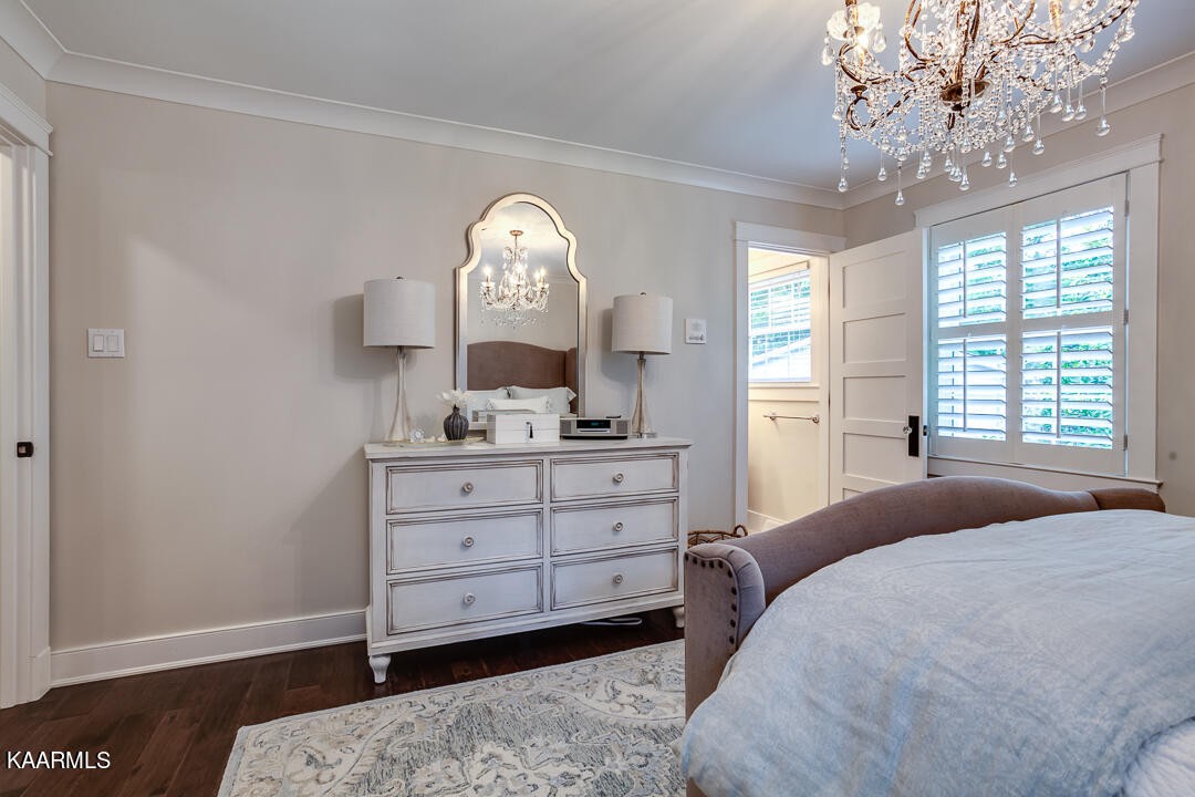 433 Smith Road Knoxville, TN 37934 - Photo 24 of 42 a bedroom with a bed and a mirror on dresser