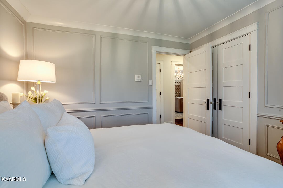 433 Smith Road Knoxville, TN 37934 - Photo 28 of 42 a bedroom with a bed and a mirror