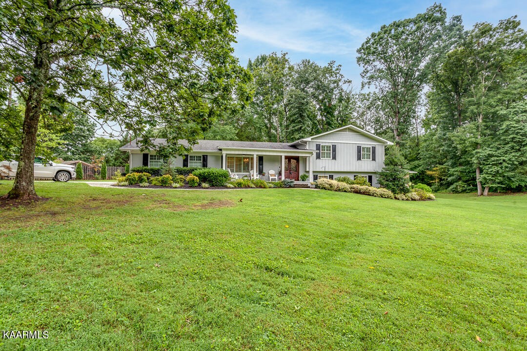433 Smith Road Knoxville, TN 37934 - Photo 3 of 42 a front view of a house with a garden