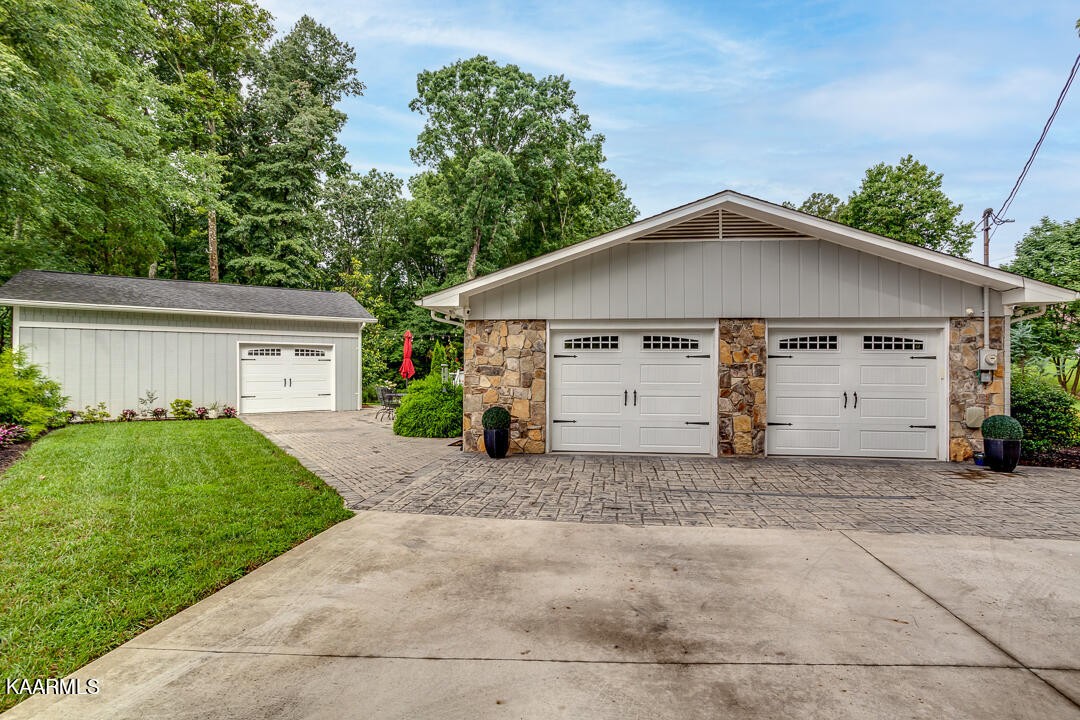 433 Smith Road Knoxville, TN 37934 - Photo 38 of 42 a view of a house with a yard plants and a large tree
