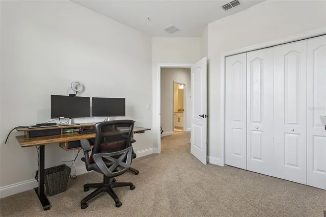 an aerial view of residential houses with outdoor space and swimming pool