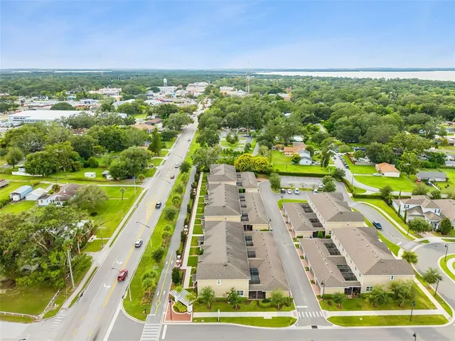 an aerial view of a house with yard