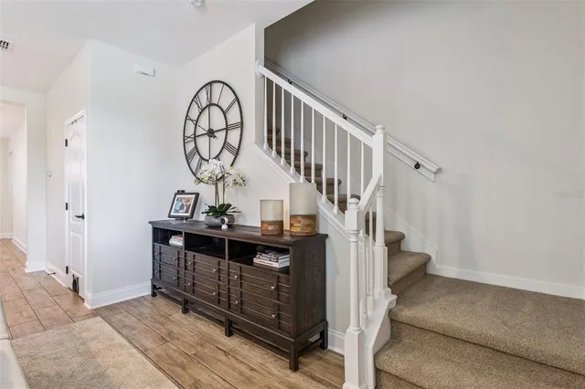 a living room with furniture a couch and a chandelier