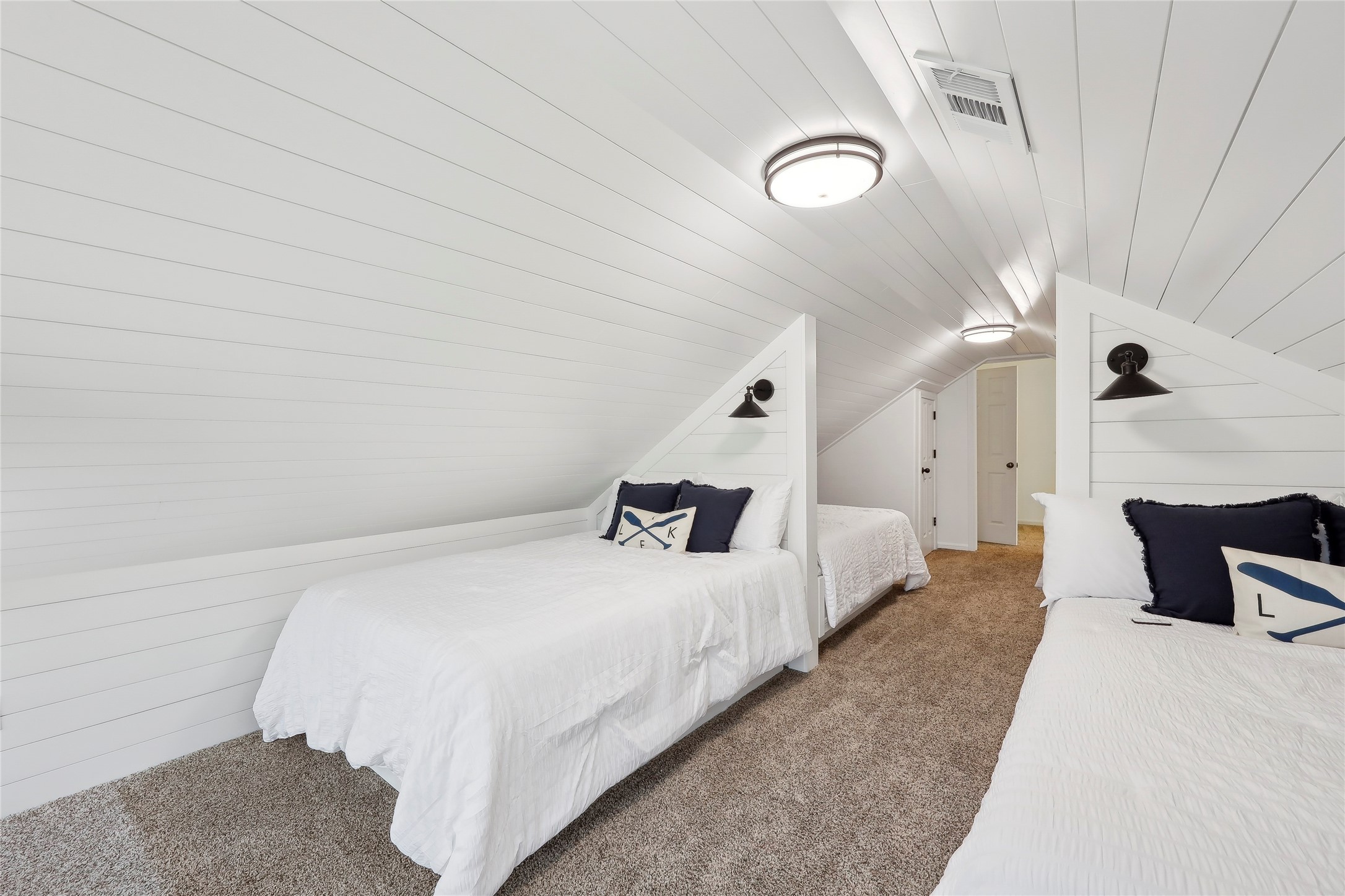 243 Riverbirch Brookeland, TX 75931 - Photo 25 of 47 a bedroom with bed and a couch