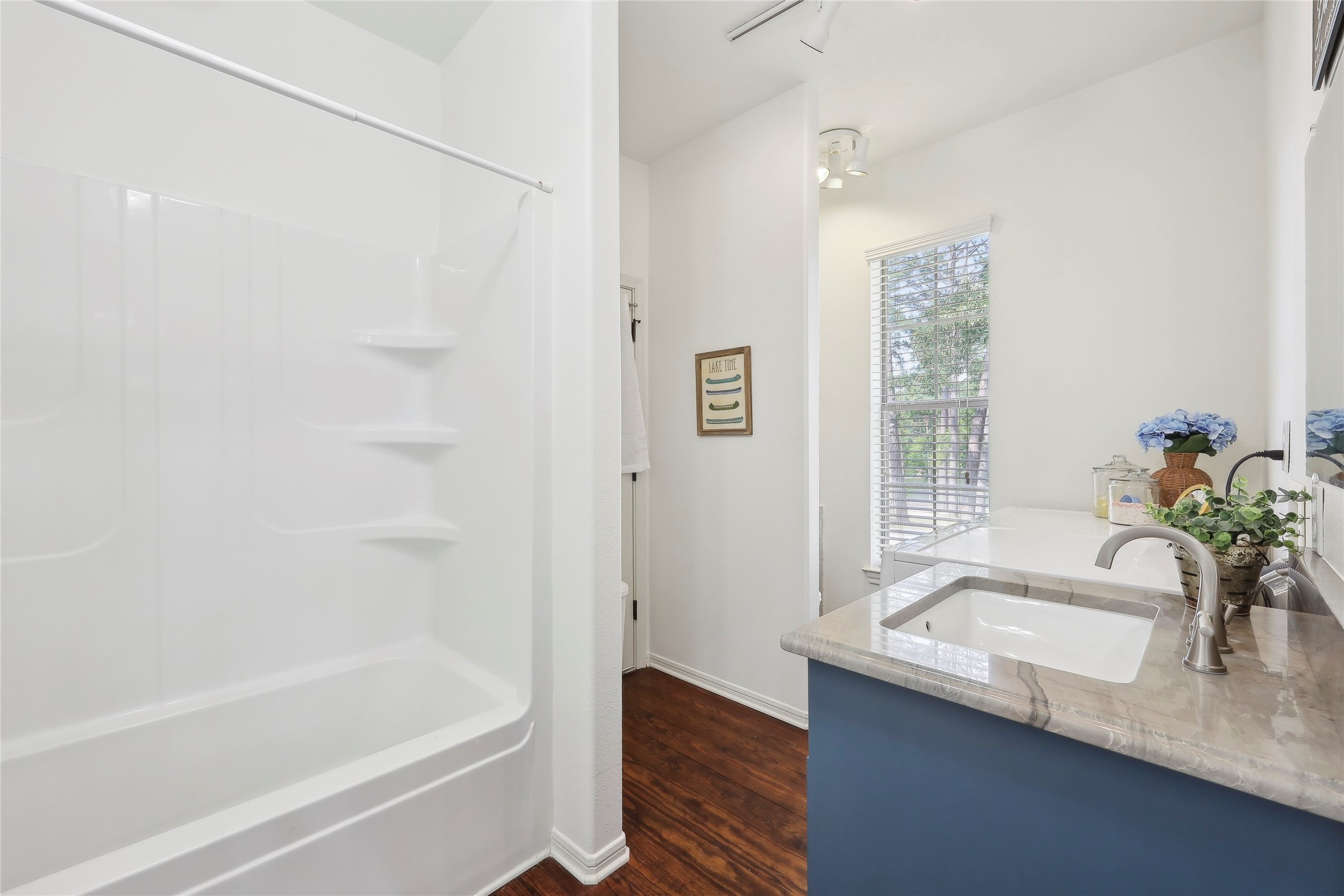 243 Riverbirch Brookeland, TX 75931 - Photo 35 of 47 a bath room with a sink and a bath tub