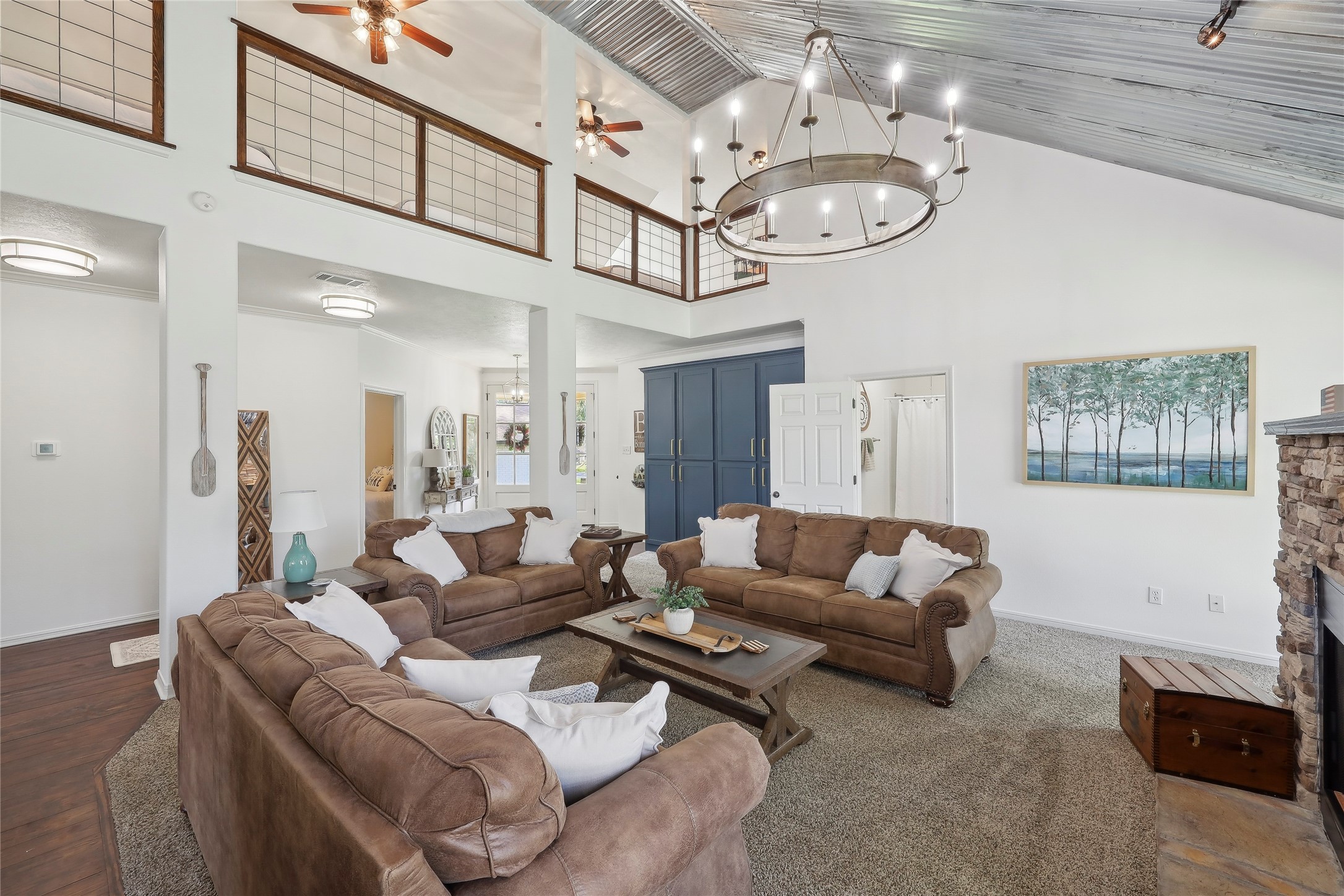 243 Riverbirch Brookeland, TX 75931 - Photo 9 of 47 a living room with furniture a clock and a chandelier