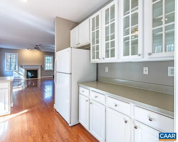 a view of kitchen with furniture wooden floor and entryway