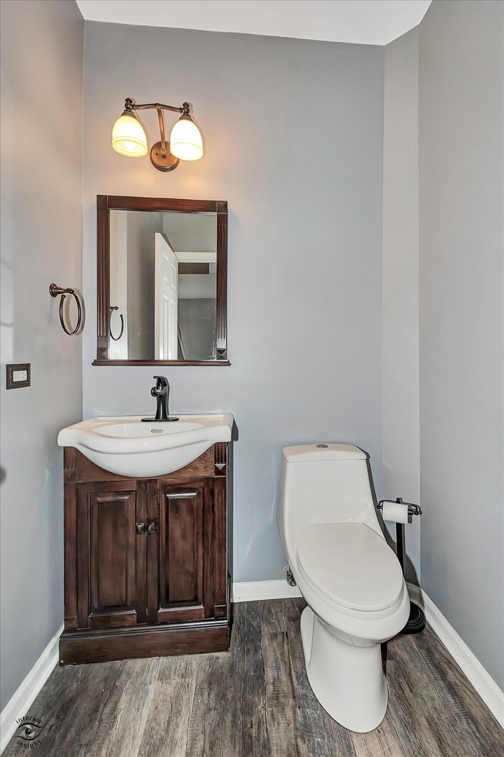 17840 Sorrel Drive Lockport, IL 60441 - Photo 15 of 27 a bathroom with a toilet a sink and mirror