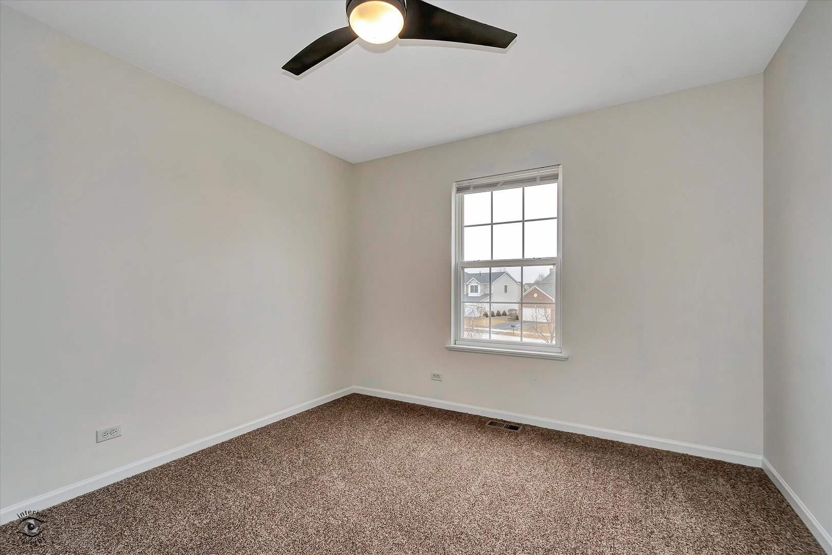 17840 Sorrel Drive Lockport, IL 60441 - Photo 25 of 27 an empty room with a window and a fan
