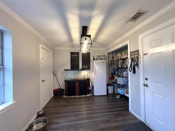a view of living room with furniture and wooden floor