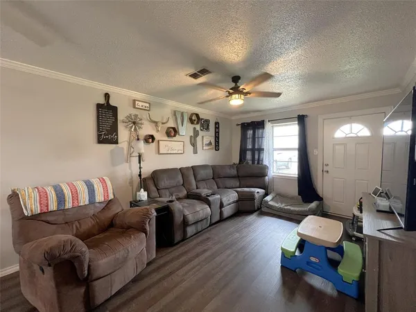 a living room with furniture or couch and a flat screen tv