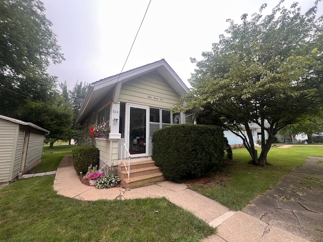 824 East Adams Street Clinton, IL 61727 - Photo 11 of 11 a front view of a house with a yard