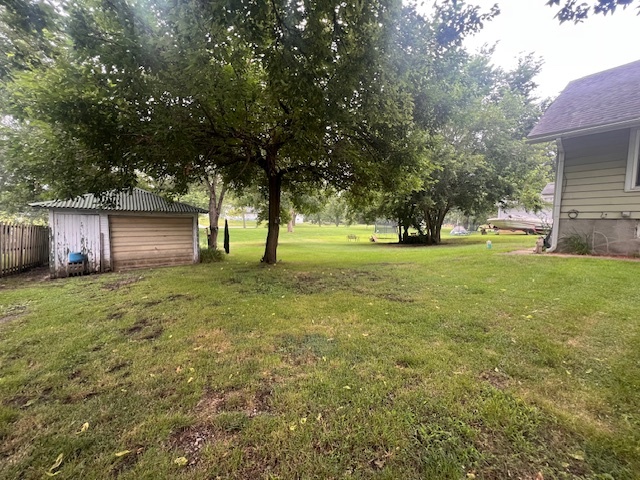 824 East Adams Street Clinton, IL 61727 - Photo 6 of 11 a view of a backyard with large trees