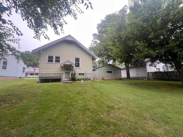 824 East Adams Street Clinton, IL 61727 - Photo 9 of 11 a front view of house with yard and trees