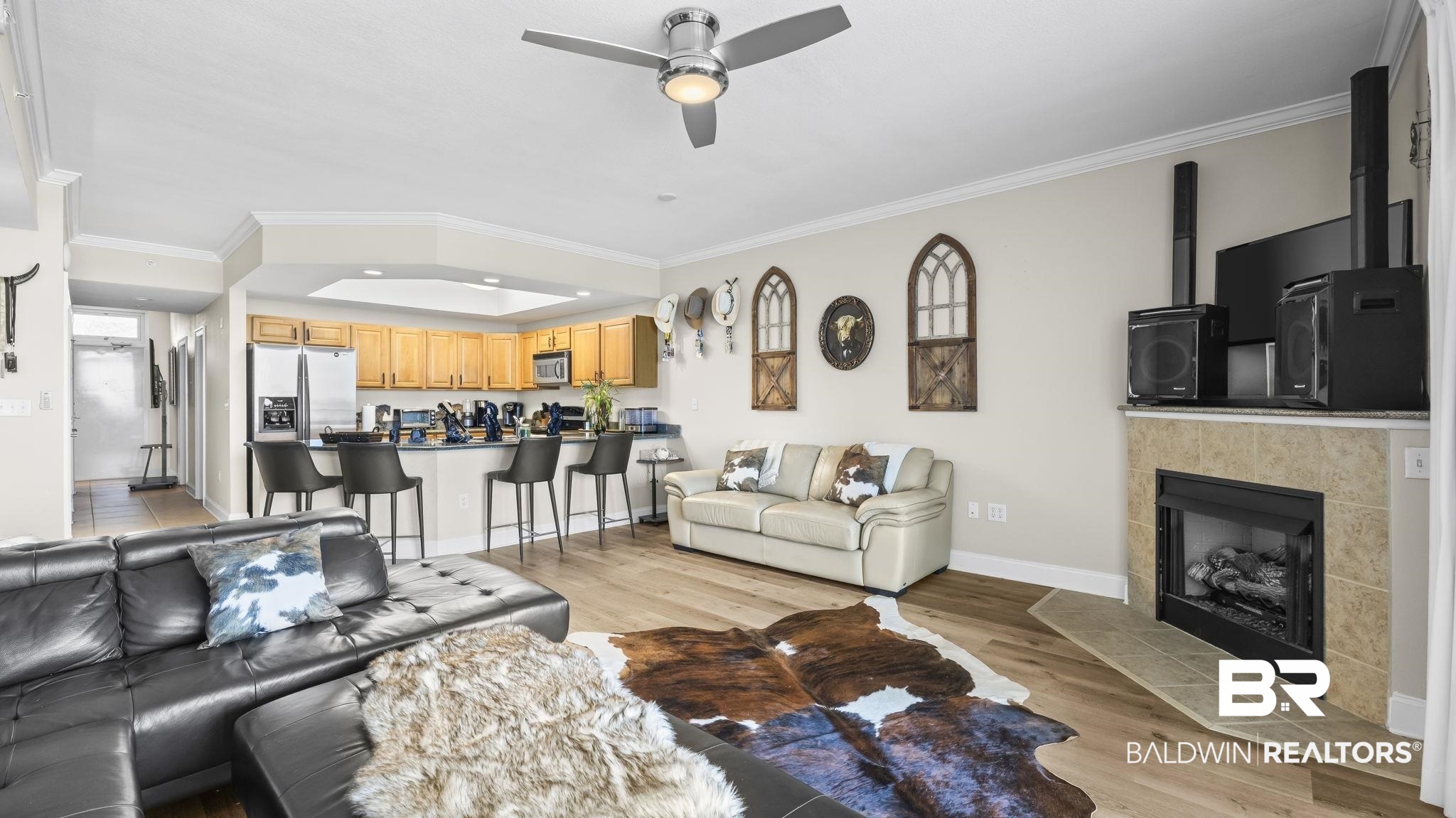 27800 Canal Road, Unit 313 Orange Beach, AL 36561 - Photo 4 of 23 Living room with ornamental molding, light wood finished floors, a ceiling fan, a fireplace, and recessed lighting