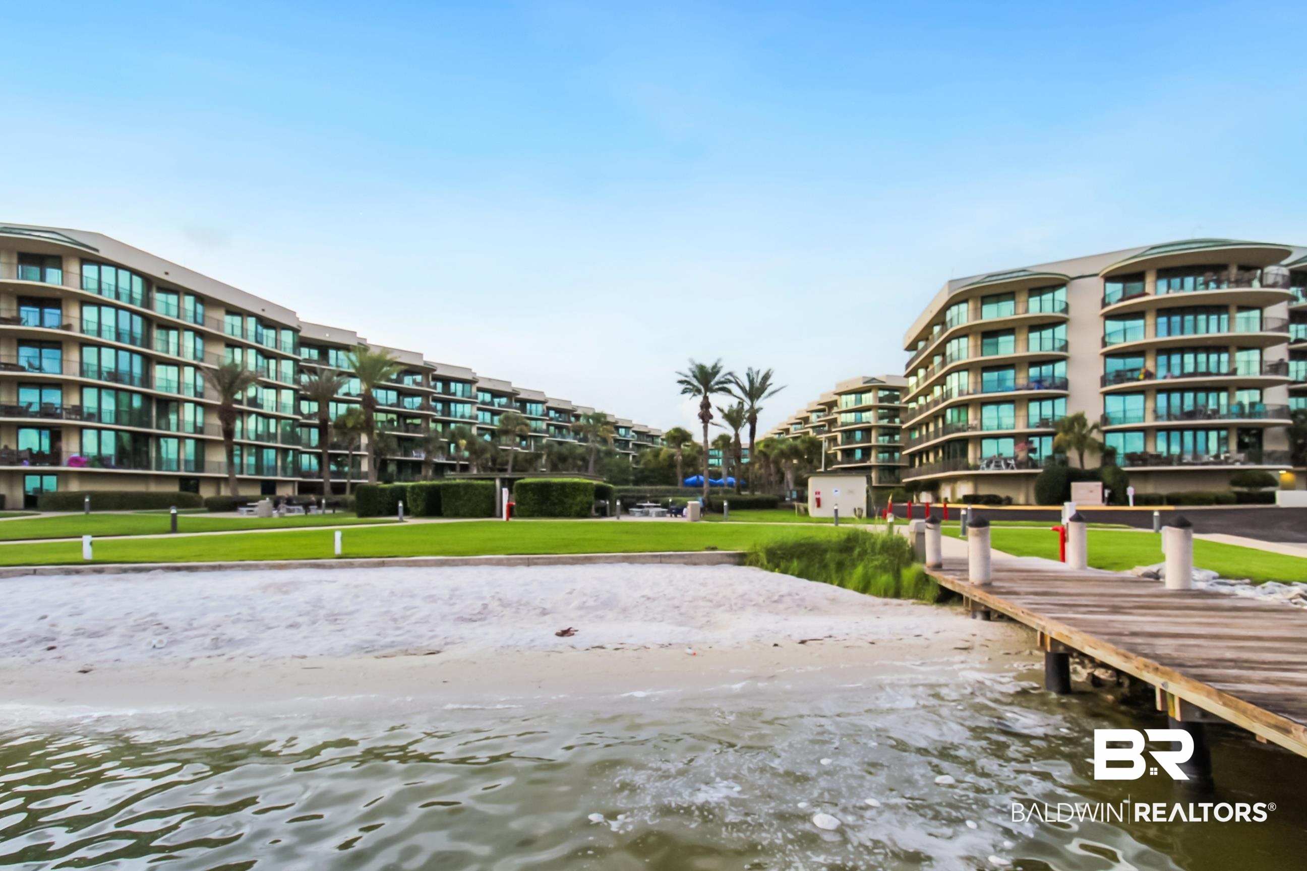 27580 Canal Road, Unit 1425 Orange Beach, AL 36561 - Photo 28 of 28 Dock area featuring a water view and a yard