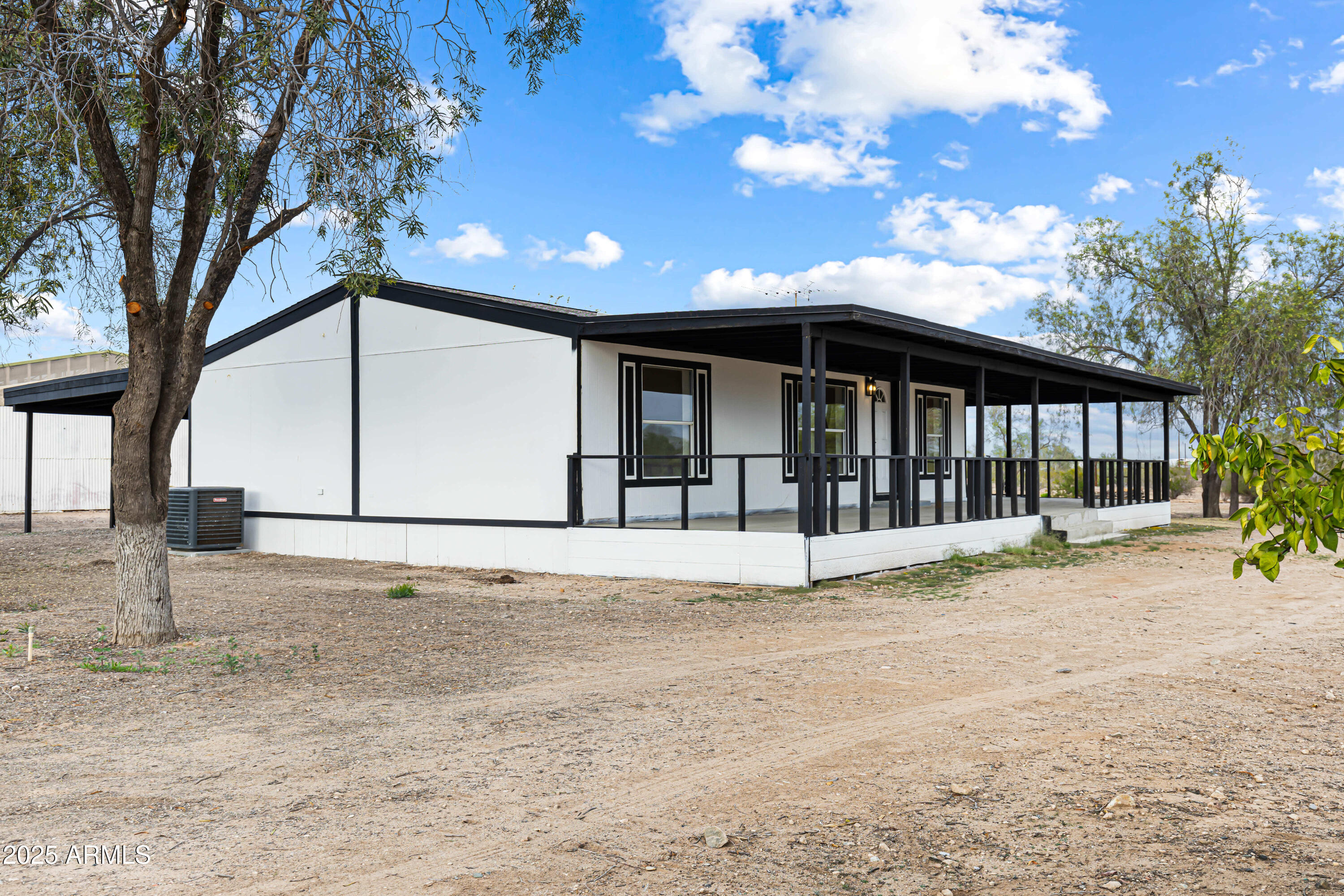 34040 West Lower Buckeye Road Tonopah, AZ 85354 - Photo 15 of 45 a view of a house with a yard
