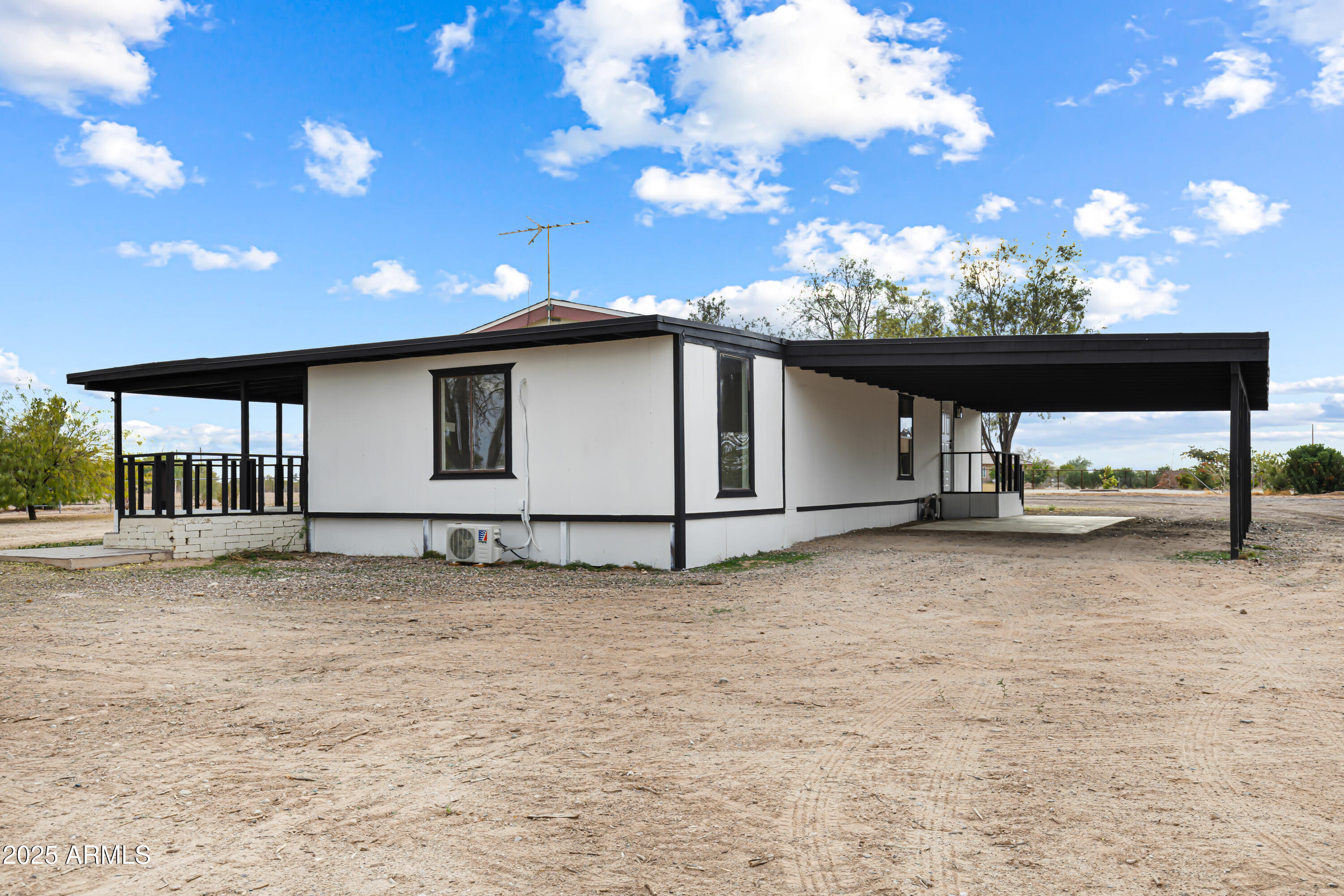 34040 West Lower Buckeye Road Tonopah, AZ 85354 - Photo 16 of 45 a view of a house with a yard