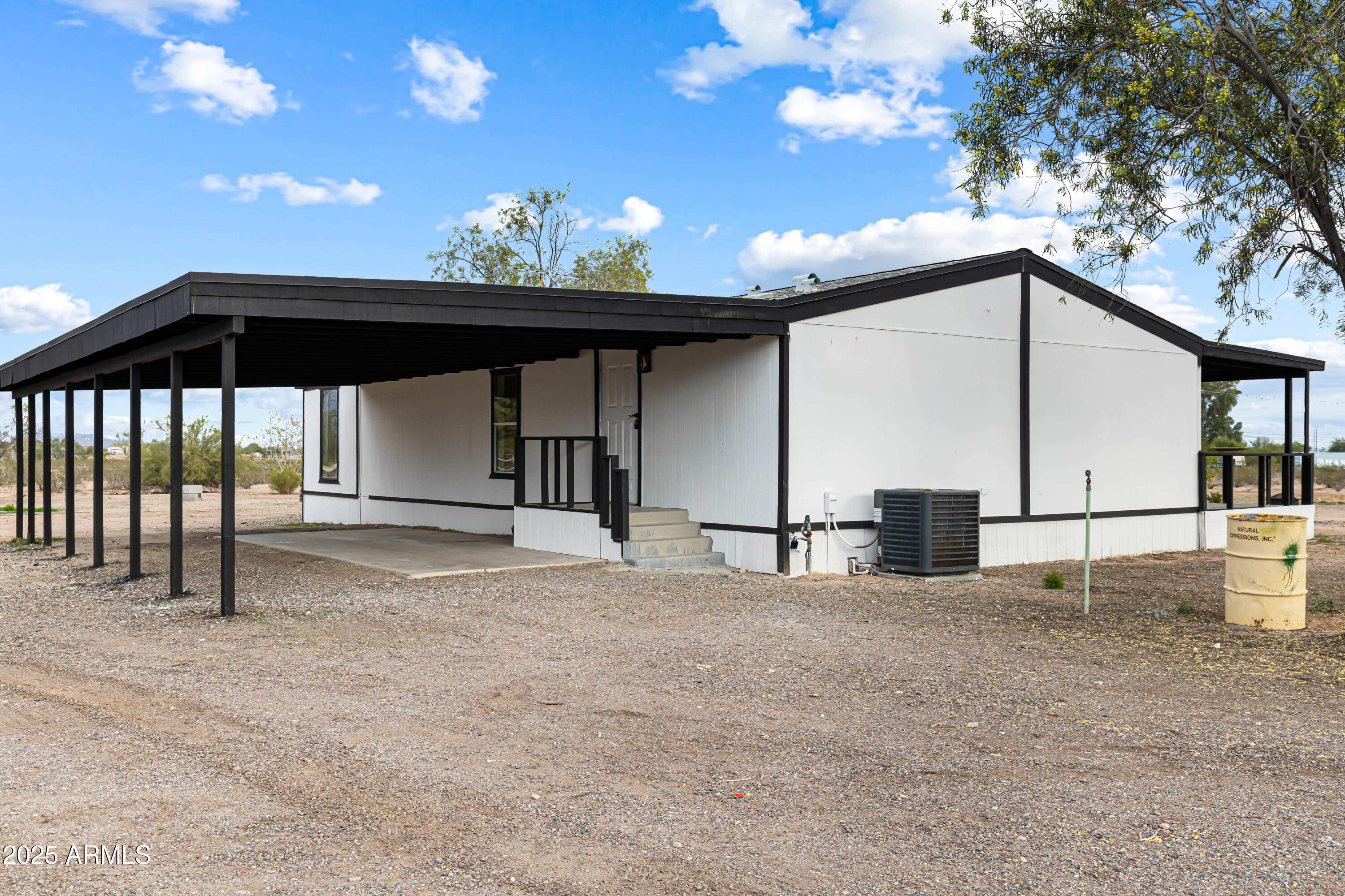 34040 West Lower Buckeye Road Tonopah, AZ 85354 - Photo 17 of 45 a view of a black and white kitchen with a sink