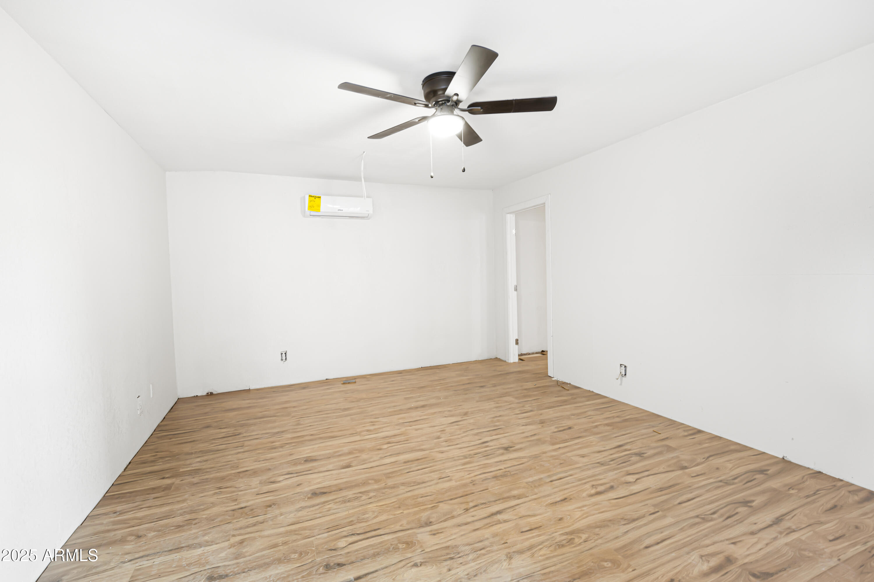 34040 West Lower Buckeye Road Tonopah, AZ 85354 - Photo 30 of 45 a view of empty room with wooden floor