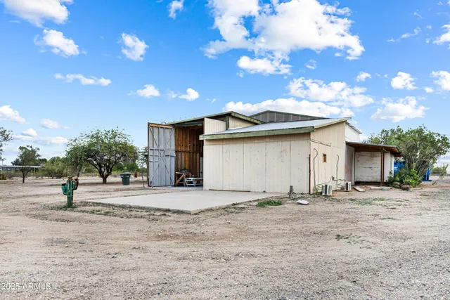 a view of a house with a yard and garage
