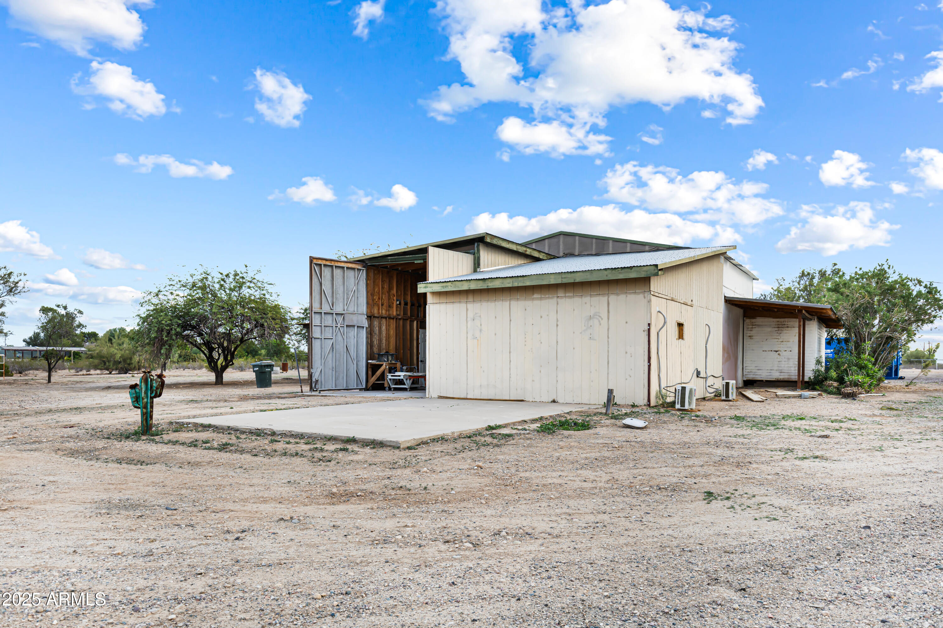 34040 West Lower Buckeye Road Tonopah, AZ 85354 - Photo 36 of 45 a view of a house with a yard and garage