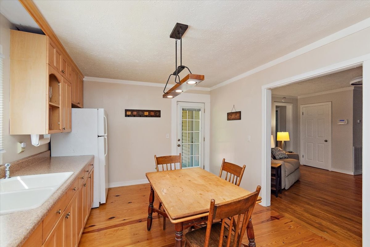 1570 Wolf Creek Road Silver Point, TN 38582 - Photo 12 of 40 a view of a dining room with furniture and wooden floor
