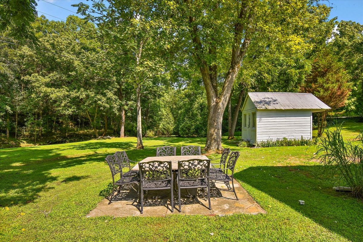 1570 Wolf Creek Road Silver Point, TN 38582 - Photo 28 of 40 a view of a chair and table in backyard of the house