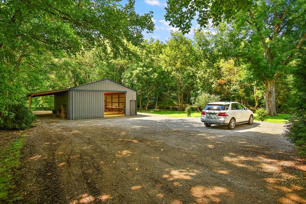 1570 Wolf Creek Road Silver Point, TN 38582 - Photo 33 of 40 a house with a car parked in front of it