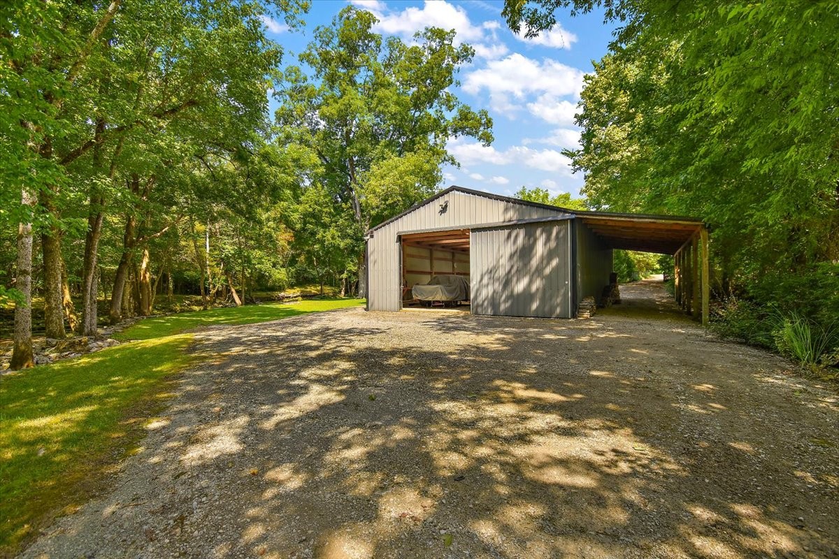 1570 Wolf Creek Road Silver Point, TN 38582 - Photo 34 of 40 a front view of a house with a yard and trees
