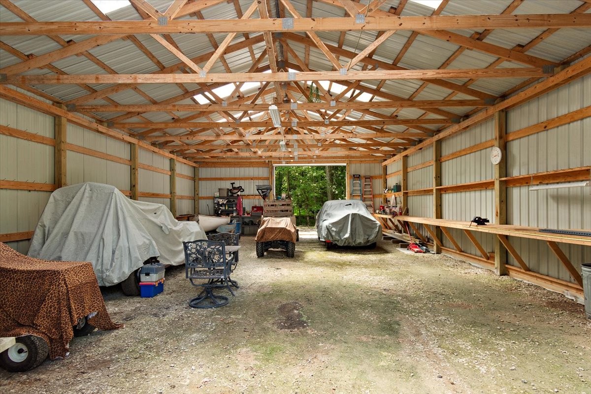 1570 Wolf Creek Road Silver Point, TN 38582 - Photo 35 of 40 a view of a garage with parked cars