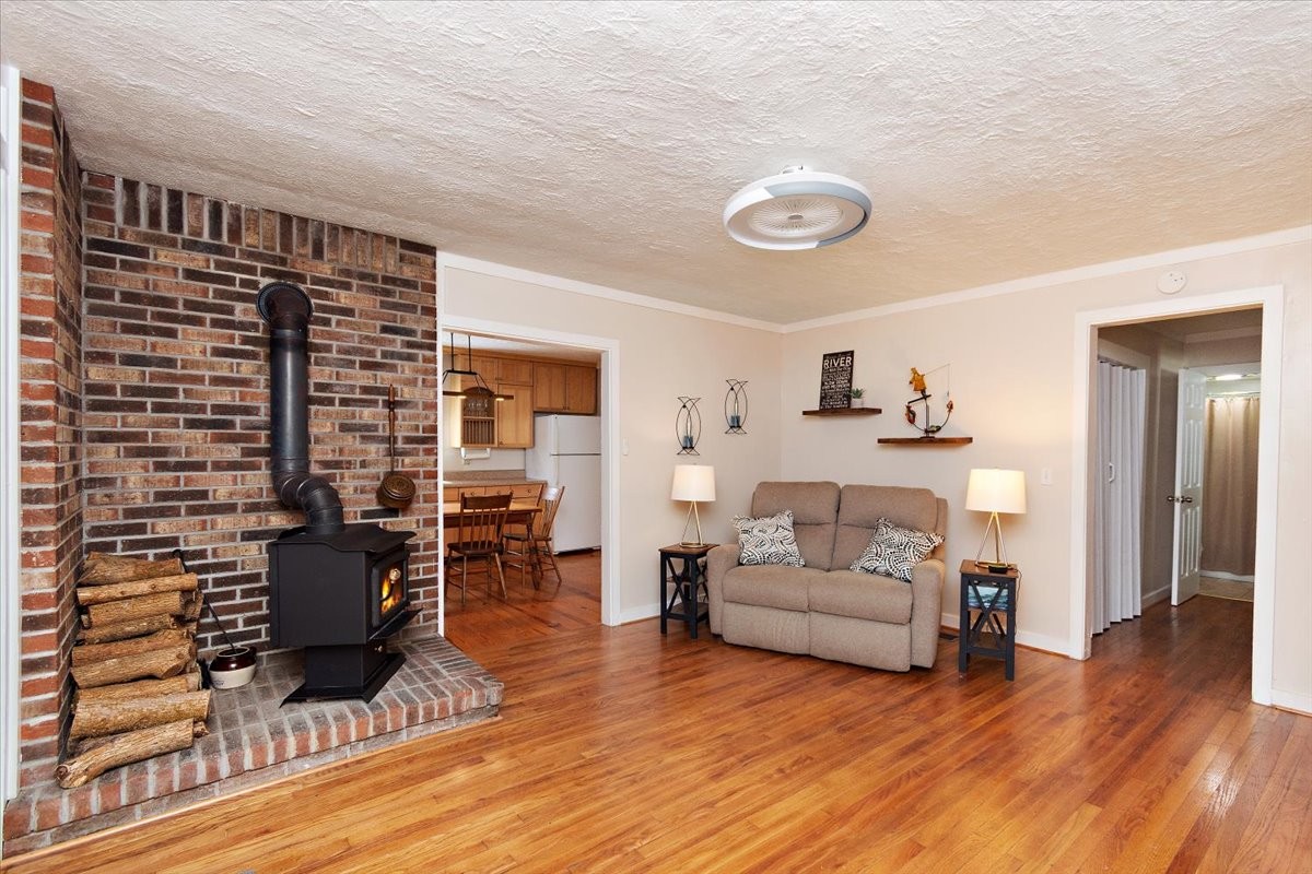 1570 Wolf Creek Road Silver Point, TN 38582 - Photo 6 of 40 a living room with furniture and a wooden floor