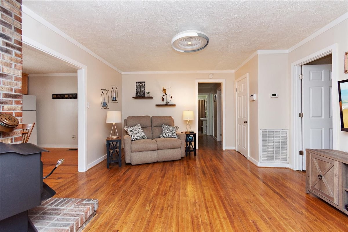 1570 Wolf Creek Road Silver Point, TN 38582 - Photo 7 of 40 a living room with furniture and a wooden floor