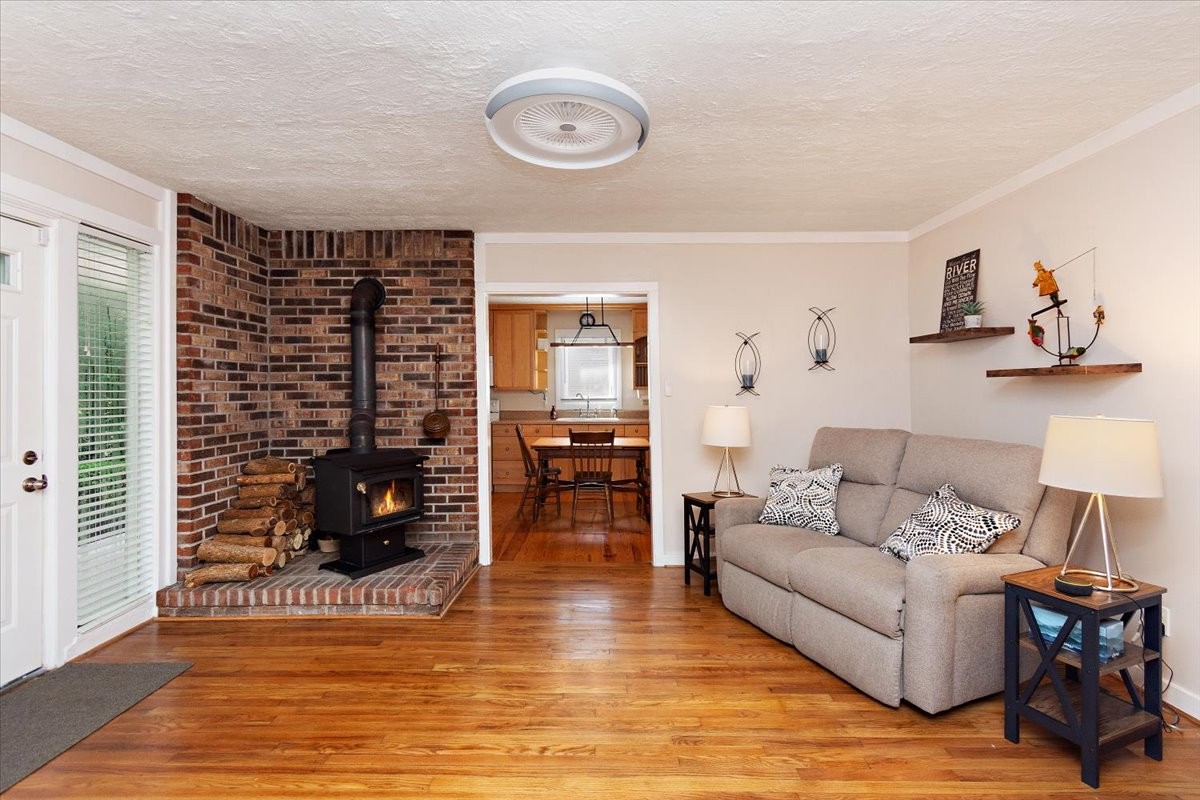 1570 Wolf Creek Road Silver Point, TN 38582 - Photo 8 of 40 a living room with furniture and a wooden floor