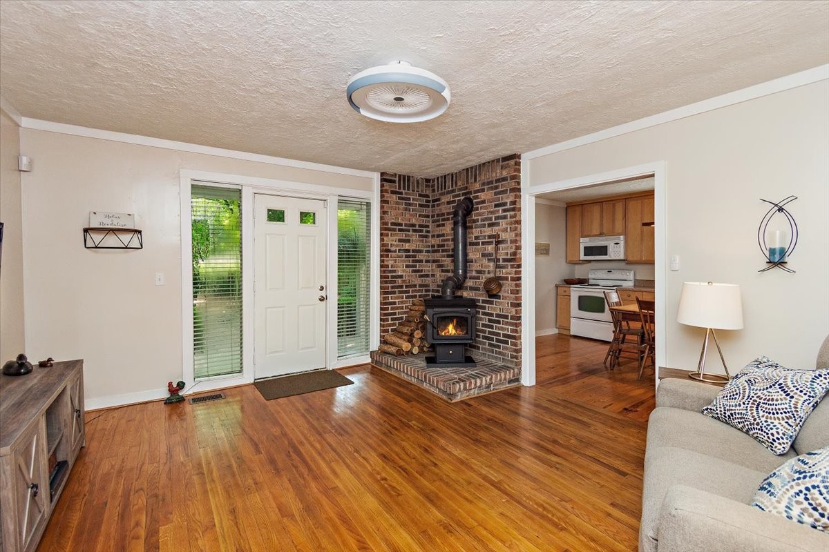 1570 Wolf Creek Road Silver Point, TN 38582 - Photo 9 of 40 a living room with furniture and a wooden floor
